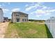 Two-story home features an open backyard with freshly installed sod and new construction at 9 W Emily Gardens Dr, Selma, NC 27576