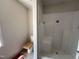 This bathroom features a new shower, toilet, new flooring and a window at 9 W Emily Gardens Dr, Selma, NC 27576