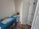 Bathroom featuring a double vanity with a dark cabinet, white countertop, and dual sinks with chrome faucets at 9 W Emily Gardens Dr, Selma, NC 27576