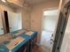 Bright bathroom featuring double sinks, large mirror, and modern fixtures ready for finishing touches at 9 W Emily Gardens Dr, Selma, NC 27576