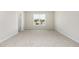 Neutral bedroom with carpet and a window overlooking greenery at 9 W Emily Gardens Dr, Selma, NC 27576
