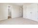 A bright bedroom featuring a walk-in closet and attached bathroom at 9 W Emily Gardens Dr, Selma, NC 27576