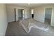 Spacious bedroom with two doorways, carpeted floors and ample natural light, ready for customization at 9 W Emily Gardens Dr, Selma, NC 27576