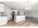 Modern kitchen with white cabinets, granite countertops, stainless steel appliances, and an island at 9 W Emily Gardens Dr, Selma, NC 27576