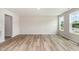 Spacious living room with beautiful wood floors and natural light streaming through large windows at 9 W Emily Gardens Dr, Selma, NC 27576
