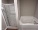 Bathroom featuring a glass enclosed shower and a white soaking tub at 91 Harvest Hills Ln, Dunn, NC 28334