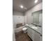 Bathroom with a granite vanity top and shower-tub combination at 91 Harvest Hills Ln, Dunn, NC 28334