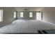 Bright, open-concept living room with plush carpeting and plenty of natural light at 91 Harvest Hills Ln, Dunn, NC 28334