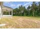 View of backyard and covered patio at 98 Laramie Ln, Selma, NC 27576