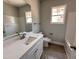 Bathroom with a white vanity, tile flooring, and a framed mirror at 98 Laramie Ln, Selma, NC 27576