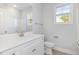Bright bathroom featuring a single sink vanity, tile floor, and ample lighting at 98 Laramie Ln, Selma, NC 27576