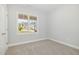 Bedroom featuring plush carpet flooring, a window, and neutral paint at 98 Laramie Ln, Selma, NC 27576