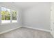 Bedroom featuring plush carpet flooring, a window, and neutral paint at 98 Laramie Ln, Selma, NC 27576