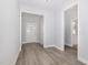 Inviting entryway with light gray walls and stylish gray wood-look flooring at 98 Laramie Ln, Selma, NC 27576