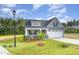 Landscaped one-story home boasting a two-car garage and a beautifully maintained lawn at 98 Laramie Ln, Selma, NC 27576