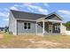 Back exterior of home with covered back patio at 98 Laramie Ln, Selma, NC 27576