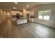 Modern kitchen with an island, stainless steel appliances, granite countertops, and ample cabinetry at 98 Laramie Ln, Selma, NC 27576