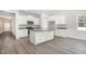 Modern kitchen with white cabinets, granite countertops, and stainless steel appliances at 98 Laramie Ln, Selma, NC 27576