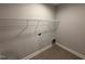 Laundry room features sleek tile floor and shelving at 98 Laramie Ln, Selma, NC 27576