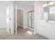 The main bath features tile flooring, white cabinets, and a glass-enclosed shower at 98 Laramie Ln, Selma, NC 27576