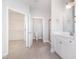 The main bath features tile flooring, white cabinets, and a walk-in closet at 98 Laramie Ln, Selma, NC 27576