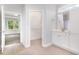 The main bath features tile flooring, white cabinets, and a walk-in closet at 98 Laramie Ln, Selma, NC 27576