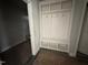 Mudroom area featuring built-in storage cubbies and coat hooks adjacent to the laundry room at 98 Laramie Ln, Selma, NC 27576