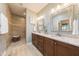 This primary bathroom boasts a walk-in shower and double vanity, making getting ready a breeze at 1005 Vesper Ct, Durham, NC 27703