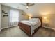 Comfortable bedroom with a ceiling fan and soft, natural light at 1005 Vesper Ct, Durham, NC 27703