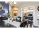 Dining room with view into the study, blue accent wall, and modern decor for inviting atmosphere at 1005 Vesper Ct, Durham, NC 27703