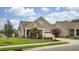 Charming single-Gathering home featuring stone accents, neutral siding, and an attached two-car garage at 1005 Vesper Ct, Durham, NC 27703