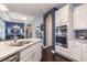Open concept kitchen with granite counters, stainless appliances, white cabinetry and view to dining area at 1005 Vesper Ct, Durham, NC 27703