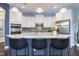 Bright kitchen features granite counters, white cabinets, and stainless steel appliances, creating a modern space at 1005 Vesper Ct, Durham, NC 27703