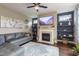 Inviting living room featuring a fireplace with marble surround and built-in shelving at 1005 Vesper Ct, Durham, NC 27703