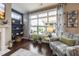 Bright and airy living room with hardwood floors, large windows, and stylish decor at 1005 Vesper Ct, Durham, NC 27703