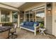 Cozy patio with blue outdoor sofa, and outdoor decorations at 1005 Vesper Ct, Durham, NC 27703
