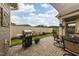 Landscaped patio and backyard with brick pavers, a grill, and manicured garden at 1005 Vesper Ct, Durham, NC 27703