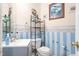 Charming half bathroom with decorative wallpaper, featuring a modern sink and toilet at 101 Elk River Ct. Ct, Mebane, NC 27302