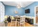 Bright dining area with modern chandelier, perfect for Gathering meals and entertaining at 101 Elk River Ct. Ct, Mebane, NC 27302