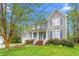 Charming two-story home featuring a cozy front porch and a well-manicured lawn at 101 Elk River Ct. Ct, Mebane, NC 27302
