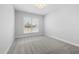 Bright bedroom features carpeted floor, window and fresh paint at 102 E Star Foal Ln, Wendell, NC 27591