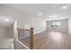 A spacious bonus room upstairs with luxury vinyl flooring and natural light at 102 E Star Foal Ln, Wendell, NC 27591