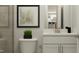 Stylish bathroom with white vanity, modern fixtures, and tiled shower at 103 Ellsworth Ct # 175, Garner, NC 27529