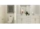 Bright bathroom with white cabinets, a double vanity, and stylish fixtures at 103 Ellsworth Ct # 175, Garner, NC 27529