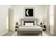 Relaxing bedroom with a gray upholstered bed, soft lighting, and neutral decor at 103 Ellsworth Ct # 175, Garner, NC 27529