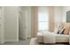 Bright bedroom with large window and neutral decor offers a peaceful retreat at 103 Ellsworth Ct # 175, Garner, NC 27529