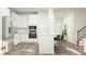 Modern kitchen with stainless steel appliances and seating for four at 103 Ellsworth Ct # 175, Garner, NC 27529
