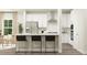 Modern kitchen featuring stainless steel appliances and a breakfast bar with seating at 103 Ellsworth Ct # 175, Garner, NC 27529