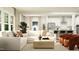Open concept living room and kitchen with island and modern appliances at 103 Ellsworth Ct # 175, Garner, NC 27529