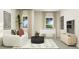 Cozy living room with comfortable seating, large windows, and decorative accents at 103 Ellsworth Ct # 175, Garner, NC 27529